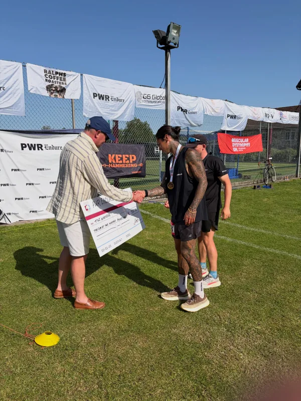 A handshake during the 2026 PWR finish-line presentation