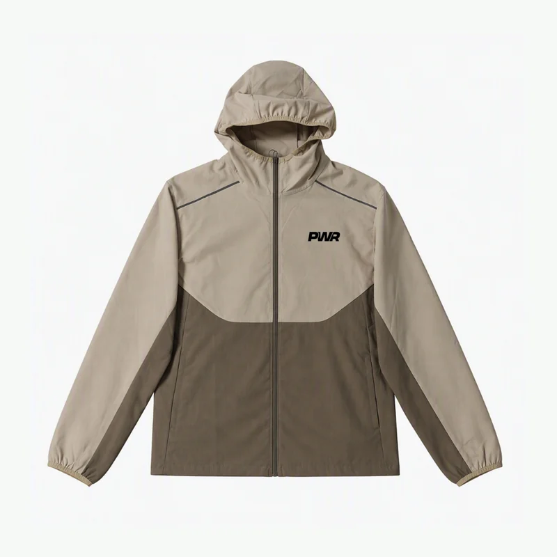 Front of the khaki PWR Run Breaker with full-length zip, two-tone panels and PWR chest logo