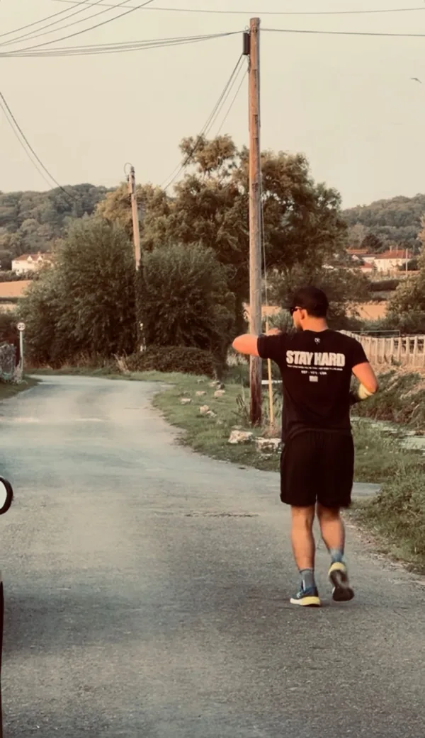 A runner heading along a quiet road during training